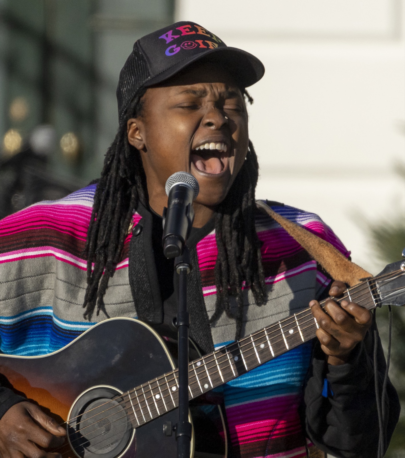 Joy Oladokun singing outdoors at the White House in December 2022.