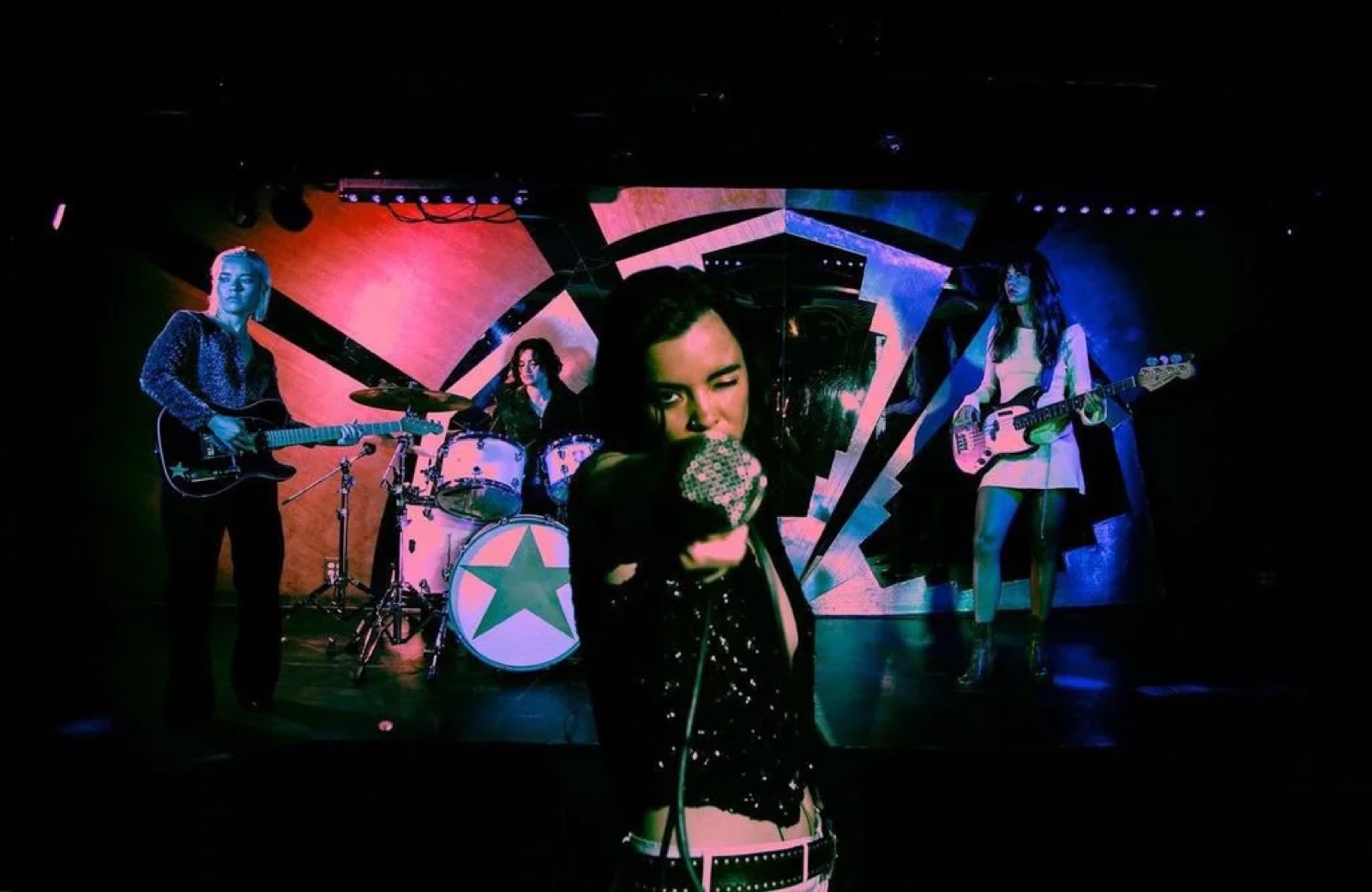 The Aces performing together in a press photograph by Dana Trippe.