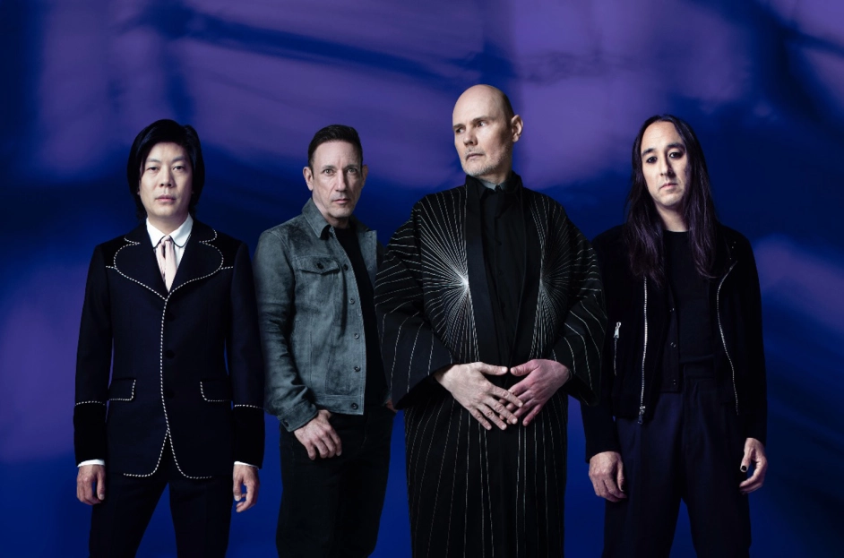 The Smashing Pumpkins posing together in a dramatic promotional portrait.