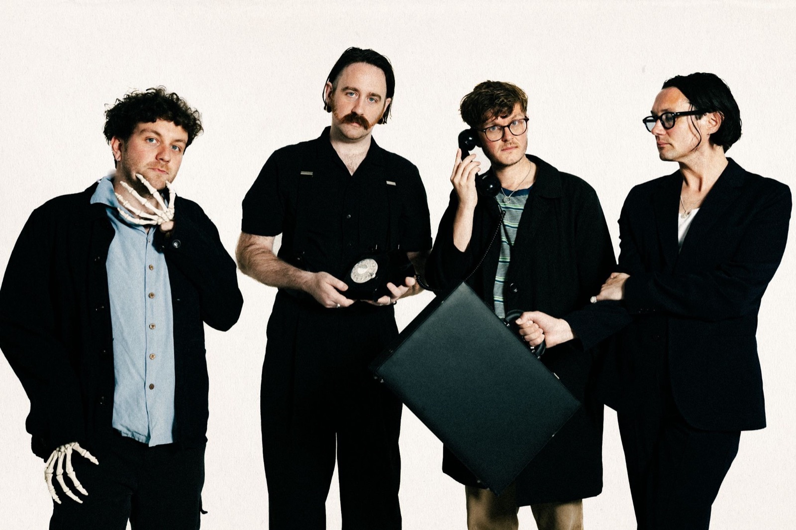 Yard Act posing together for a playful band promotional photograph.